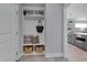 Stylish mudroom with built-in storage, hooks, and seating, perfect for organization at 3020 High Plains Dr, Fuquay Varina, NC 27526
