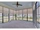 Relaxing sunroom with large windows and carpet flooring, perfect for all-season enjoyment at 3020 High Plains Dr, Fuquay Varina, NC 27526