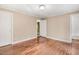 Spacious bedroom featuring hardwood floors and neutral color paint that offers a comfortable living space at 306 Union Ave, Burlington, NC 27217
