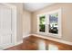 Bright bedroom with hardwood floors and sunlit windows, offering a serene retreat at 306 Union Ave, Burlington, NC 27217