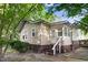 Rear elevation featuring backyard, steps to enter, and siding at 306 Union Ave, Burlington, NC 27217