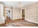 Bright living room with hardwood floors, neutral paint, and open entryways enhance a cohesive living space at 306 Union Ave, Burlington, NC 27217