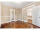 Cozy living room featuring hardwood floors and neutral paint, bathed in natural light at 306 Union Ave, Burlington, NC 27217