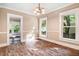 Cozy living room with hardwood floors, large windows offering natural light, and neutral walls at 306 Union Ave, Burlington, NC 27217