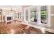 Bright and airy living room boasts hardwood floors, fireplace, and lots of natural light from the large windows at 306 Union Ave, Burlington, NC 27217