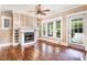 Bright and airy living room boasts hardwood floors, fireplace, and lots of natural light from the large windows at 306 Union Ave, Burlington, NC 27217