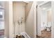 Practical utility room with hookups, leading to a functional bathroom area at 306 Union Ave, Burlington, NC 27217