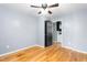 This bedroom features hardwood floors and an open door at 307 W Austin St, Mebane, NC 27302