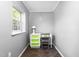 Small bedroom with a desk, green accents, and a window for natural light at 307 W Austin St, Mebane, NC 27302