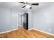 Charming bedroom with hardwood floors, gray walls, and an open closet door at 307 W Austin St, Mebane, NC 27302