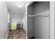 A gray room with a desk, chair and closet space at 307 W Austin St, Mebane, NC 27302