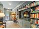 Comfortable basement area with built-in shelving, TV, and access to an outside patio at 3308 Cobblestone Court Ct, Raleigh, NC 27607
