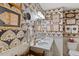 Stylish bathroom with patterned wallpaper, double vanity, oval mirror and decorative framed art at 3308 Cobblestone Court Ct, Raleigh, NC 27607