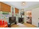 Spare bedroom showcasing natural light, neutral walls, and access to the laundry room at 3308 Cobblestone Court Ct, Raleigh, NC 27607