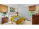 Serene bedroom with white walls, natural window coverings, a ceiling fan, and a queen-sized bed at 3308 Cobblestone Court Ct, Raleigh, NC 27607