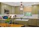 Well-equipped kitchen featuring custom cabinets, stainless steel appliances, and a center island at 3308 Cobblestone Court Ct, Raleigh, NC 27607