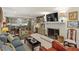 Open-concept living space showcasing a fireplace, built-in shelving, and a seamless flow to the kitchen at 3308 Cobblestone Court Ct, Raleigh, NC 27607