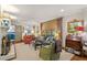 Well-lit living room features wooden floors, comfortable seating, and stylish decor at 3308 Cobblestone Court Ct, Raleigh, NC 27607