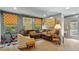 Inviting living room featuring a comfortable brown sectional, unique art, and sunlit windows at 3308 Cobblestone Court Ct, Raleigh, NC 27607
