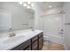 Bright bathroom featuring a double sink vanity with a modern tub and shower combination at 337 Botan Way, Hillsborough, NC 27278