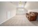 Spacious bonus room with plush carpeting, a window, and a comfortable couch at 337 Botan Way, Hillsborough, NC 27278