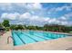 Large community pool with clear water and plenty of lounge chairs for relaxing by the poolside at 337 Botan Way, Hillsborough, NC 27278