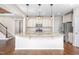Spacious kitchen island with granite countertops and modern appliances at 337 Botan Way, Hillsborough, NC 27278