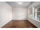 Well-lit room with hardwood floors and neutral walls, ready for your personal touch at 337 Botan Way, Hillsborough, NC 27278