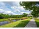 Scenic view of the community pond, complete with lush greenery at 337 Botan Way, Hillsborough, NC 27278