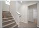Carpeted staircase leading to the upper level of the home with natural light at 337 Botan Way, Hillsborough, NC 27278