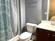 Bathroom featuring a toilet, vanity with sink, and patterned shower curtain with a shower stall at 3650 Pleasants Ridge Dr, Wake Forest, NC 27587