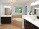 Luxurious bathroom with double vanities, a soaking tub, and a chandelier at 3650 Pleasants Ridge Dr, Wake Forest, NC 27587