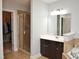 Bathroom featuring a walk-in shower, dark wood cabinets and tile floors at 3650 Pleasants Ridge Dr, Wake Forest, NC 27587