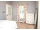 Serene bedroom with floral curtains, a white dresser, and soft natural light at 3650 Pleasants Ridge Dr, Wake Forest, NC 27587
