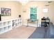 Bright bedroom with natural light, a gray sofa, light beige carpet, and built in shelves at 3650 Pleasants Ridge Dr, Wake Forest, NC 27587