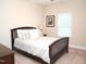 Cozy bedroom with a full size bed, neutral walls, carpet and large window at 3650 Pleasants Ridge Dr, Wake Forest, NC 27587