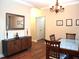 Elegant dining room featuring modern decor, stylish table, and beautiful hardwood floors at 3650 Pleasants Ridge Dr, Wake Forest, NC 27587