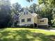 Well-maintained two-story home with a manicured lawn and a variety of surrounding trees at 3650 Pleasants Ridge Dr, Wake Forest, NC 27587
