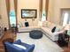 Inviting living room with large sectional, accent chair, and elegant decor at 3650 Pleasants Ridge Dr, Wake Forest, NC 27587
