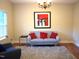 Comfortable living room with a grey sofa, decorative pillows, and a fluffy rug at 3650 Pleasants Ridge Dr, Wake Forest, NC 27587