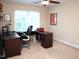 Office space with an L-shaped desk, computer, rolling chair, and a large window at 3650 Pleasants Ridge Dr, Wake Forest, NC 27587
