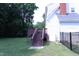 Exterior showcasing a wood deck, black metal fence, and grassy backyard at 3832 Doeskin Dr, Apex, NC 27539