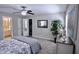 Spacious bedroom features carpet, ceiling fan, closet, and modern decor at 3832 Doeskin Dr, Apex, NC 27539