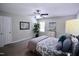 Bedroom with a ceiling fan, carpet, and large window at 3832 Doeskin Dr, Apex, NC 27539