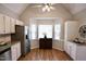 Eat-in kitchen with stainless appliances, lots of cabinets, and bay window at 3832 Doeskin Dr, Apex, NC 27539
