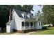 Side exterior view of the home showcasing the roof, siding, and porch area at 3832 Doeskin Dr, Apex, NC 27539