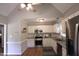 Bright kitchen featuring stainless steel appliances, white cabinets, and subway tile backsplash at 3832 Doeskin Dr, Apex, NC 27539