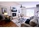 Comfortable living room with fireplace, area rug, and access to the patio at 3832 Doeskin Dr, Apex, NC 27539