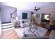 Bright living room features stairs to the left and view to dining room on the right at 3832 Doeskin Dr, Apex, NC 27539
