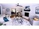 Open living room showcases a fireplace and seamless flow to the dining area at 3832 Doeskin Dr, Apex, NC 27539